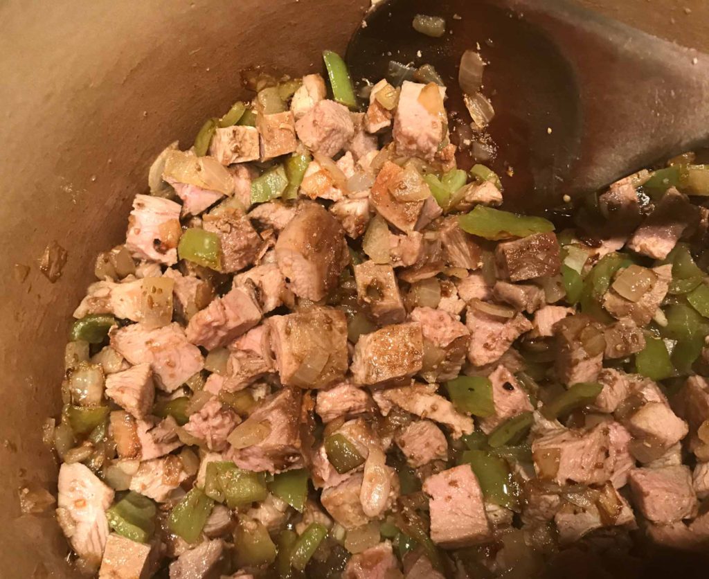 diced duck in pan